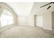 Bright, carpeted bedroom with vaulted ceiling, fan and double door closet at 10555 Serra Vista Pt, Fishers, IN 46040