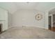 Large living room features neutral carpeting and a fireplace with white trim at 10555 Serra Vista Pt, Fishers, IN 46040