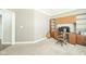 Office featuring built-in bookshelves, desk, and neutral carpet at 10555 Serra Vista Pt, Fishers, IN 46040