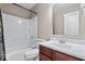 Bathroom features a shower and bath combo with a vanity sink with tile flooring at 11509 Reagan Dr, Fishers, IN 46038