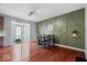 View of the dining area featuring a dining table with chairs, a large window, and stylish decorative wall trim at 11509 Reagan Dr, Fishers, IN 46038