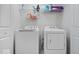 Laundry room featuring a washer, dryer, storage shelves, and convenient access at 11509 Reagan Dr, Fishers, IN 46038