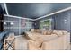 View of the living room featuring a large sectional couch, and large window at 11509 Reagan Dr, Fishers, IN 46038