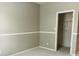 A cozy bedroom featuring neutral carpet and trim, gray walls and access to a closet at 1176 Everton Ct, Greenwood, IN 46143