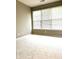 A bright bedroom with neutral carpet and multiple windows letting in natural light at 1176 Everton Ct, Greenwood, IN 46143