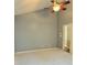 Spacious bedroom featuring neutral carpet, large ceiling fan, and access to a closet/bathroom at 1176 Everton Ct, Greenwood, IN 46143