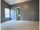 A cozy bedroom featuring neutral carpet and trim, gray walls and a window with blinds at 1176 Everton Ct, Greenwood, IN 46143