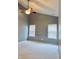 A cozy bedroom featuring neutral carpet and trim, gray walls and two windows with blinds at 1176 Everton Ct, Greenwood, IN 46143