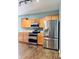 Modern kitchen featuring stainless steel appliances, wooden cabinets, and lots of counter space at 1176 Everton Ct, Greenwood, IN 46143