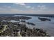 Scenic lake view of a waterfront community with beautiful homes and mature trees at 11931 Promontory Ct, Indianapolis, IN 46236