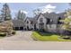 Charming brick home with a manicured lawn and mature trees at 11931 Promontory Ct, Indianapolis, IN 46236