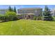 Expansive backyard with a patio, outdoor furniture, grilling area, and well-manicured lawn at 1294 Vista Way, Greenwood, IN 46143