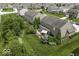 Expansive backyard featuring a patio area, mature trees, and lush green landscaping perfect for outdoor living at 1294 Vista Way, Greenwood, IN 46143