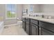 Bathroom with double sinks, and granite countertops at 1294 Vista Way, Greenwood, IN 46143