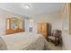 Charming bedroom with classic furnishings, including a wooden dresser and rocking chair at 1294 Vista Way, Greenwood, IN 46143