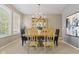 Formal dining room with elegant chandelier and neutral walls at 1294 Vista Way, Greenwood, IN 46143