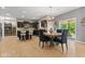 Well-lit dining area with a modern table and chairs, adjacent to the kitchen at 1294 Vista Way, Greenwood, IN 46143