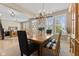 Formal dining room with elegant chandelier and neutral walls at 1294 Vista Way, Greenwood, IN 46143
