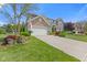Charming two-story home with landscaped yard and attached two-car garage at 1294 Vista Way, Greenwood, IN 46143