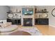 Close-up of the stone fireplace and built-in shelves in the cozy living room at 1294 Vista Way, Greenwood, IN 46143