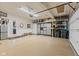 Garage featuring epoxy flooring, built in storage, and white wainscotting at 1294 Vista Way, Greenwood, IN 46143