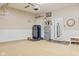 Garage featuring painted floor, storage cabinets, and workbench at 1294 Vista Way, Greenwood, IN 46143