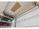 View of garage featuring garage door, storage racks, and ceiling access panel at 1294 Vista Way, Greenwood, IN 46143