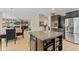 Open concept kitchen with large island, stainless appliances, and eat in area at 1294 Vista Way, Greenwood, IN 46143