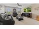 Living room with leather sofa, accent chair, TV, and carpet at 1294 Vista Way, Greenwood, IN 46143