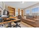 Home office with a comfortable couch, wooden bookshelves, and a modern adjustable desk at 1294 Vista Way, Greenwood, IN 46143