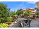 Grilling area, dining table and outdoor lounge area with plush greenery and blue sky at 1294 Vista Way, Greenwood, IN 46143