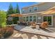 Outdoor patio with comfortable seating, fire pit, and stylish umbrellas for shade at 1294 Vista Way, Greenwood, IN 46143