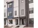 Modern townhouse exterior with black trim windows and a sleek front door, enhancing its curb appeal at 1315 Colere Pl, Indianapolis, IN 46203