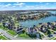 Scenic aerial showcasing upscale homes nestled along a tranquil lake with private docks and lush landscaping at 13613 Lake Ridge Ln, McCordsville, IN 46055