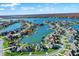 Breathtaking aerial shot of waterfront homes lining a beautiful lake, complete with boat docks and lush greenery at 13613 Lake Ridge Ln, McCordsville, IN 46055