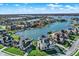 Stunning aerial view of waterfront community with luxurious homes, private docks, and serene lake waters at 13613 Lake Ridge Ln, McCordsville, IN 46055