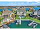 Panoramic aerial view of lakeside houses with private docks, offering scenic water access and upscale living at 13613 Lake Ridge Ln, McCordsville, IN 46055