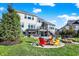 Expansive backyard featuring a patio, pool, outdoor kitchen, and fire pit at 13613 Lake Ridge Ln, McCordsville, IN 46055