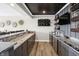 Modern bar area with custom cabinetry and ample counter space for entertaining at 13613 Lake Ridge Ln, McCordsville, IN 46055