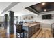 Finished basement bar with elegant countertops and decorative barrel accents at 13613 Lake Ridge Ln, McCordsville, IN 46055