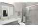 This bathroom features a water closet with a glass door and a marble countertop at 13613 Lake Ridge Ln, McCordsville, IN 46055