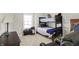 This bedroom features a bunk bed and views of the front yard at 13613 Lake Ridge Ln, McCordsville, IN 46055