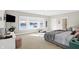 This bedroom features water views and access to a private bathroom at 13613 Lake Ridge Ln, McCordsville, IN 46055