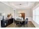 Elegant dining room with hardwood floors, recessed lighting, and stylish decor perfect for Gathering gatherings at 13613 Lake Ridge Ln, McCordsville, IN 46055