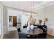 Elegant dining room featuring a modern chandelier and decorative accents at 13613 Lake Ridge Ln, McCordsville, IN 46055
