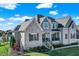 Elegant two-story home with stone accents, manicured landscaping, and a welcoming front porch at 13613 Lake Ridge Ln, McCordsville, IN 46055