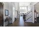 Grand foyer showcasing high ceilings, staircase, and elegant decor at 13613 Lake Ridge Ln, McCordsville, IN 46055