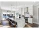 Modern kitchen featuring a center island and stainless steel appliances at 13613 Lake Ridge Ln, McCordsville, IN 46055