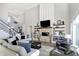 Bright and open living room with fireplace and staircase at 13613 Lake Ridge Ln, McCordsville, IN 46055