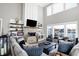Inviting living room with a stone fireplace and built-in shelves at 13613 Lake Ridge Ln, McCordsville, IN 46055